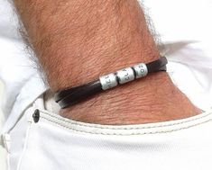 "Custom engraved leather bracelet for men. A gift for father. Personalized leather bracelet with rings. this personalized bracelet is a perfect gift for father, brother, boyfriend. This bracelet is a perfect gift for a man. The bracelet will remind him every day that you love him. This engraved bracelet reminds you of people and dates that are important to you. It can make him smile and be happy. P E R S O N A L I Z E Engraving is done by hand, it is deep and has a permanent color. You can write Personalized Silver Leather Bracelet, Personalized Leather Bracelets With Engraving Option, Leather Bracelets For Father's Day, Silver Leather Bracelet For Father's Day, Personalized Engraved Leather Jewelry, Father's Day Leather Bracelets For Everyday Wear, Silver Engraved Leather Bracelets For Father's Day, Silver Engraved Leather Bracelet For Father's Day, Adjustable Leather Bracelet With Engraving Option For Father's Day