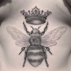 a bee with a crown on it's back is shown in black and white