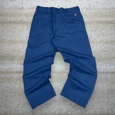 Vintage Dickies Khakis Pants Navy Blue Relaxed Fit Flat Front Work Wear 90s Skate / Streetwear Great Condition: 7/10 (small marks, aka some character) Men's Size:  Waist: 36" Length (inseam): 30" Leg Opening: 9" Thigh Opening: 13" Front Rise: 13" Relaxed Fit Blue Cargo Pants With Belt Loops, Casual Blue Tapered Leg Work Pants, Blue Cotton Work Pants With Pockets, Retro Blue Bottoms For Streetwear, Blue Relaxed Fit Work Pants With Pockets, Casual Blue Work Pants With Hip Pockets, 90s Style Cotton Cargo Pants, Retro Blue Bottoms With Pockets, Relaxed Fit 90s Cotton Bottoms