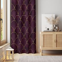 a living room with a large window and a purple shower curtain