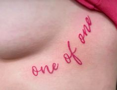 a woman's breast with the word one of it written in cursive writing