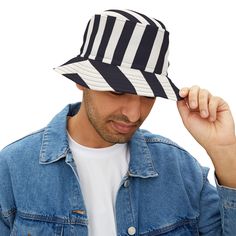 First, it protected fishermen from rain in the 1900s. Now, the black and white striped bucket hat is making its way to the very top of fashion picks for all ages. Choose the seam lines, add your zaniest designs and patterns on the bucket hat and make a modern wardrobe staple come to life.  .: Material: 100% polyester .: Available in 2 sizes .: Two stitching color options to pick from .: Sewn-in label .: Made in USA Black Retro Bucket Hat For Summer, Navy Wide Brim Bucket Hat For Summer, Striped Cotton Hat With Curved Brim, Navy Bucket Hat With Curved Brim For Summer, Casual Striped Sun Hat With Short Brim, Navy Bucket Hat For Summer, Casual Striped Short Brim Hat, Summer Striped Cotton Hat, Navy Summer Bucket Hat