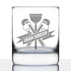 a glass with the words drain surgeon on it