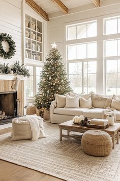 a living room filled with furniture and a christmas tree in front of a fire place