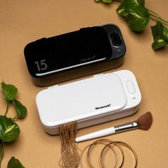 the contents of an electronic device sitting on a table next to some plants and scissors