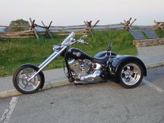 a black motorcycle parked on the side of the road