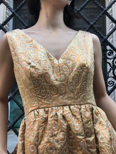 60's Gold brocade V neck dress,The epitome of 60's party dress. An absolutely stunning design The gold color and beautiful silk brocade fabric is amazing, zipper in the back, 2 pockets, gathered at the waist, lined.Ready to wear to formal event, dance party, or a prom.Size S, shoulders 14.5, bust 16.5, waist 12.5, length 36.5, zipper 19.5 in perfect vintage condition Etsy Shipping -Vintage and pre-owned items may have signs of wear and use and are offered as is. Traces of age and use are therefo 60's Party, Party Dress Formal, Silk Brocade Fabric, Flowy Jumpsuit, Purple Lace Dress, Green Silk Dresses, White Floral Print Dress, Dress And Jacket Set, Gold Brocade