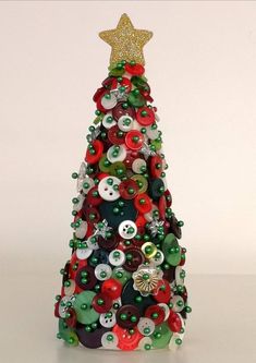 a small christmas tree made out of buttons