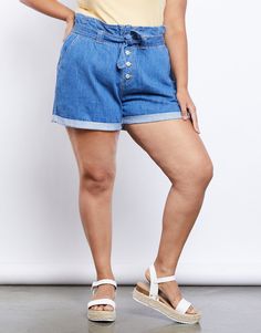 We are so on board with the paper bag silhouette trend. Our newest obsession? Definitely the Curve Denim Paper Bag Shorts. These adorable denim shorts are so easy to wear and pair, making them a staple in any closet. They feature a button fly with four buttons, a matching denim belt to cinch the waist, and four real pockets. They are made from a lightweight but non-stretchy denim material and have cuffed bottom hems. We love! Model is 5’6”, bust 41”, waist 34”, hips 43”, and is wearing a size 1X Denim Paper, Bag Silhouette, Paper Bag Shorts, Plus Size Denim, Denim Belt, On Board, Plus Size Outfits, Paper Bag, Denim Shorts