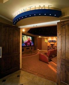 a home theater room with a large screen