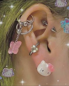 an ear with hello kitty charms attached to it