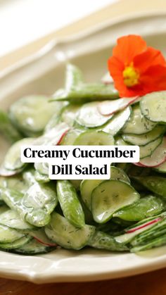 a white plate topped with cucumbers and radishes on top of a wooden table