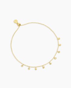 Elevate your bracelet look with the Chloe Mini Bracelet. This adjustable gold plated bracelet is perfect for layering and creating a sophisticated bracelet stack. Its dainty size is great for elegantly accessorizing any outfit. Delicate discs in our classic Chloe texture flutter across your wrist in this adjustable piece. Perfect to wear alone or layer with your other gorjana favorites. Delicate Adjustable Yellow Gold Charm Bracelet, Elegant Adjustable Tarnish Resistant Anklets, Elegant Adjustable Anklets For Everyday Wear, Elegant Yellow Gold Anklets With Delicate Chain, Dainty Gold-tone Bracelet With Delicate Chain, Delicate Adjustable Gold Charm Bracelet, Elegant Adjustable 14k Gold-filled Anklets, Elegant Adjustable 14k Gold Filled Anklets, Elegant Gold Anklets In 14k Gold Filled