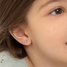 These forever classic screw-back earrings feature bright and stunning cubic zirconia in a prong setting. Crafted entirely in 925 sterling silver with a cubic zirconia stone, they are hypoallergenic and safe for children with sensitive ears. They feature a threaded earring post and back to ensure your child's earrings stay safely and comfortably in place. A complimentary gift box is included. Pink Cubic Zirconia Earrings With Prong Setting, Pink Birthstone Round Earrings, Pink Cubic Zirconia Single Earring, Sterling Silver Pink Birthstone Earrings, Pink Round Clip-on Earrings For Gift, Round Solitaire, Solitaire Earrings, Kids Earrings, Screw Back Earrings