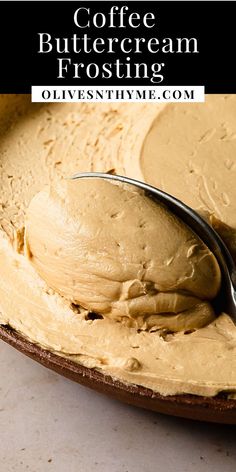 a spoon full of coffee butter frosting on top of a plate with the words coffee buttercream frosting over it