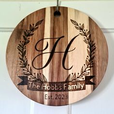 a wooden plaque with the letter f on it that says, the hobos family est 1222