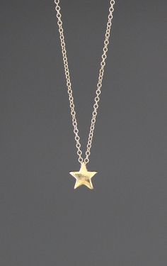 "A very petite shiny 14k gold vermeil Star charm simply dangles from a fine 14k gold filled chain. The chain is finished with a spring ring clasp. It is adjustable and can be worn close to the neck at 16\" or a little longer at 18\". Please note this charm is very small. Multiple quantities can be ordered by special order. Star charm: 8x7mm Total length of pendant: 1/4\" Gold chain: 1mm As the owner, maker, designer, and curator of this shop, I take great pride in providing you with jewelry that 14k Gold-filled Star Charm Jewelry, Simple Star-shaped Jewelry With Star Charm, Everyday Star-shaped Yellow Gold Jewelry, Everyday Yellow Gold Star Jewelry, Gold Star Of David Charm Necklace With Delicate Chain, Simple Star Charm Jewelry Gift, Yellow Gold Star Charm Necklace With Adjustable Chain, 14k Gold Filled Star Charm Jewelry, 14k Gold Filled Star-shaped Yellow Gold Jewelry