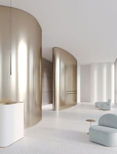 an empty room with white and gold walls