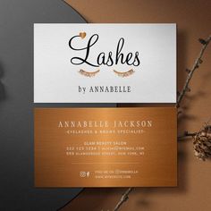 two business cards with lashes on them