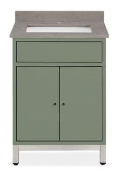 a green cabinet with a white sink and black legs on the bottom, in front of a white background