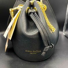 New Black Pebble Leather Anna Paola Hobo Bucket Bag Nwt Brand New With Tags - Never Been Used! Add A Gorgeous Bit Of Style To Your Wardrobe With This Black Leather Bucket Bag. Height: 8” Width: 10” Detachable Top Carry Handle Detachable Shoulder Chain Strap Ring Detail Gold-Tone Hardware Drawstring Top With Pull Microsuede Lining Internal Slip Pocket Pebbled Leather Made In Italy Classic Black Bucket Shoulder Bag, Black Bucket-shaped Formal Bag, Classic Black Textured Leather Bucket Bag, Black Bucket Bag For Formal Occasions, Black Textured Leather Crossbody Bucket Bag, Black Textured Leather Satchel Bucket Bag, Black Soft Leather Bucket Shoulder Bag, Textured Leather Bucket Bag For Daily Use, Daily Use Textured Leather Bucket Bag