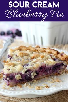 a slice of blueberry pie on a white plate