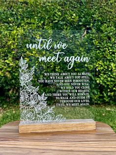 a clear acrylic plaque with the words until we meet again written on it