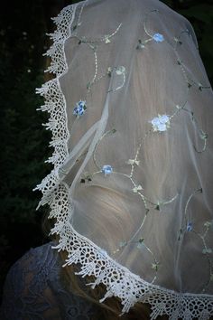 "A delicate, feminine, and reverent veil for worship. This is SOFT! This is a new take on an older style; a one piece princess veil, that falls nicely, and has a sewn-in clip to keep it in place. High quality embroidered ivory/Marian blue rose floral lace, trimmed in an elegant white Venise trim. It comes with our free veil storage bag! Please convo us with any questions or special requests! Also in \"D\" shape: https://www.etsy.com/listing/504196111/evintage-veilsst-therese-little-flower?ref=sh Elegant Wedding Dupatta For Spring, Bohemian Spring Wedding Dupatta, Bohemian Dupatta For Spring Wedding, Blue Spring Wedding Dupatta, Blue Wedding Dupatta For Spring, Blue Dupatta For Spring Wedding, Spring Wedding Cream Dupatta, Cream Dupatta For Spring Wedding, Vintage Lace Wedding Veil