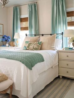 the bedroom is decorated in shades of gray, green and white