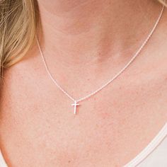 This tiny silver cross necklace is a classic addition to your layering necklaces. This minimalist necklace is also perfect by itself. The cross charm is sterling silver and measures approximately 12 mm in length or 1/2 inch. The chain is delicate looking but sturdy sterling silver. This dainty cross necklace is available in lengths from 15 - 18 inches. You may choose to add an attached extender. Your new necklace will come in a box, ready for gift giving. More Christian jewelry https://www.etsy. Simple Everyday Cross Jewelry, Delicate Everyday Cross Necklace, Simple Cross Clavicle Chain Jewelry, Simple Clavicle Chain Cross Jewelry, Dainty Cross Necklace For Everyday Wear, Minimalist Hypoallergenic Cross Jewelry, Minimalist Cross Pendant Necklace For Everyday, Simple Cross Jewelry With Delicate Chain, Simple Necklace With Delicate Chain And Cross Pendant