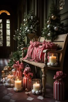 a bench with candles and christmas decorations on it