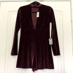 Woman’s Express Velvet Wine Colored Romper. Size Small. Deep V In Front, Zips Up Back. Long Sleeves. Brand New Never Worn. Fitted Jumpsuits And Rompers For Fall Date Night, Fitted Jumpsuits And Rompers For Going Out In Fall, Fitted Burgundy Jumpsuits And Rompers, Blush Pink Jumpsuit, Black Strapless Jumpsuit, Black Sleeveless Jumpsuit, One Piece Jumper, Denim Overalls Shorts, One Shoulder Jumpsuit