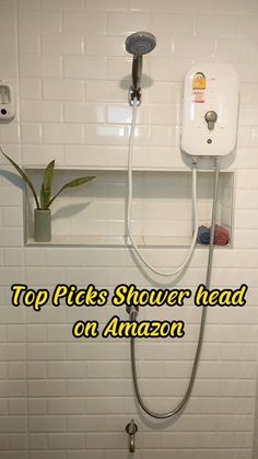 the shower head is connected to an amazon faucet in a bathroom with white tiled walls