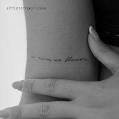 a woman's hand with a small tattoo on her left arm that reads, no rain no flowers