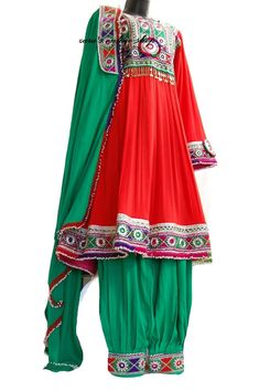 afghan kuchi traditional wedding drees is made of good quality long lasting fabric. Traditionally such Afghanistan Persian Pashtun new design frocks are used as bridal dress. Most of girls also like and recommend such dresses for wedding, Nikkah and Mehndi night events. The dress measurements are kept average. If you need this frock in exact measurements you need, then please send us measurements which best fit on your body Green Kurta With Dupatta For Festival, Bohemian Red Anarkali Set With Zari Work, Green Kurta With Traditional Drape For Festival, Red Mirror Work Anarkali For Traditional Ceremonies, Red Salwar Kameez With Mirror Work For Traditional Ceremonies, Red Anarkali Dress For Festivals, Bollywood Style Red Festival Dress, Traditional Green Salwar Kameez For Festival, Traditional Green Festival Salwar Kameez