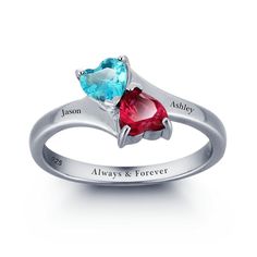 two heart shaped rings with names engraved on them, one is blue and the other is red