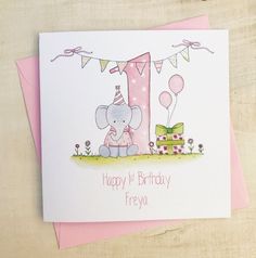 a birthday card with an elephant holding a present