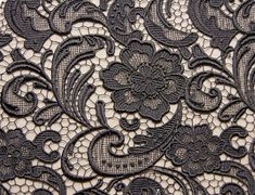 an image of black lace with flowers on it