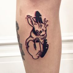 a small tattoo on the leg of a person