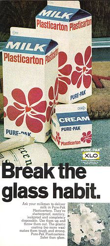 an advertisement for milk from the 1950's with flowers on boxes and other items