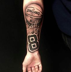 a man's arm with a basketball tattoo on it that says ball life is 8