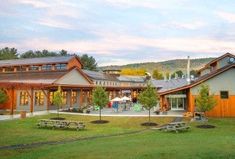 the building has picnic tables in front of it