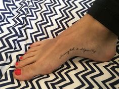 a woman's foot with a tattoo on it that says, i love you