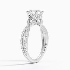 a white gold engagement ring with diamonds on it