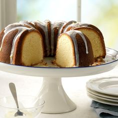 a bundt cake with white icing and drizzled on the top