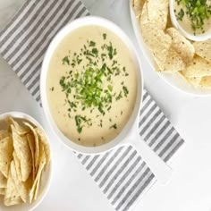 two bowls of quesadilla soup with tortilla chips on the side