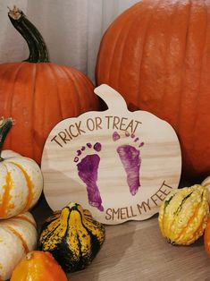 pumpkins and gourds with the words trick or treat written on them