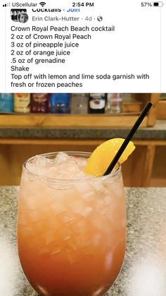 an orange drink sitting on top of a counter