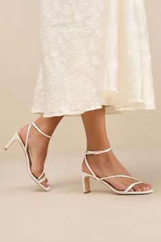 Keep things chic and simple by adding the Lulus Kierha White Satin Strappy Low Heel Sandals to any of your effortlessly elegant 'fits! Sleek woven satin shapes these darling heels that feature a square footbed and a trio of slender straps that cross the vamp. A matching strap wraps the front of the ankle and secures with a gold buckle, all atop a trendy blade heel. 2. 75" wrapped blade heel. Cushioned insole. Felted rubber sole has nonskid markings. Man made materials. Imported. Lulus | Kierha White Satin Strappy Low Heel Sandal Heels | Size 6.5. Strappy Wedding Heels, Elegant Fits, Bridesmaids Heels, White Strappy Sandals, Low Heel Sandals, Size 11 Heels, Sandal Heels, Strappy Sandals Heels, White Heels