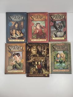 six children's books are stacked on top of each other, including spiderwick